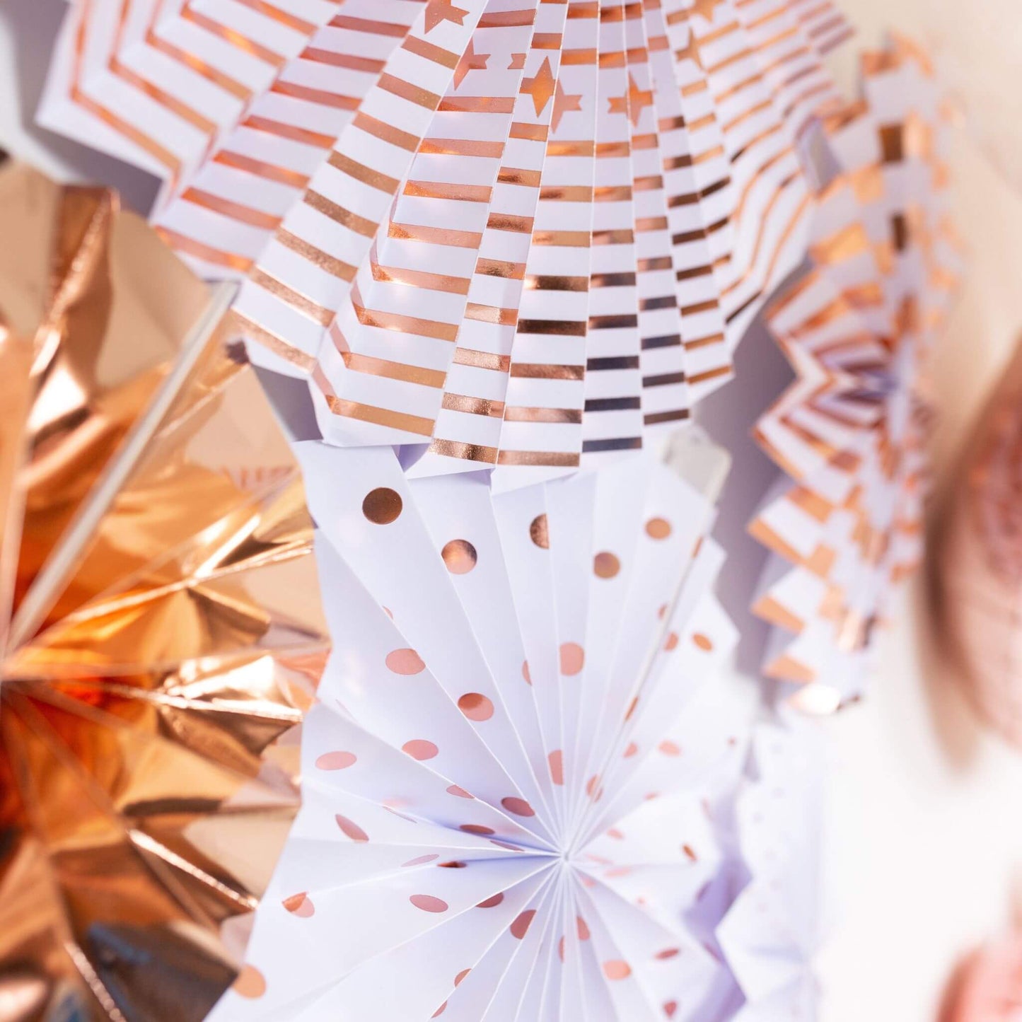 Rose gold paper fan decorations 